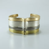 nishnabotna jewelry, stack of gold, silver, brass furrow cuff bracelets with bend